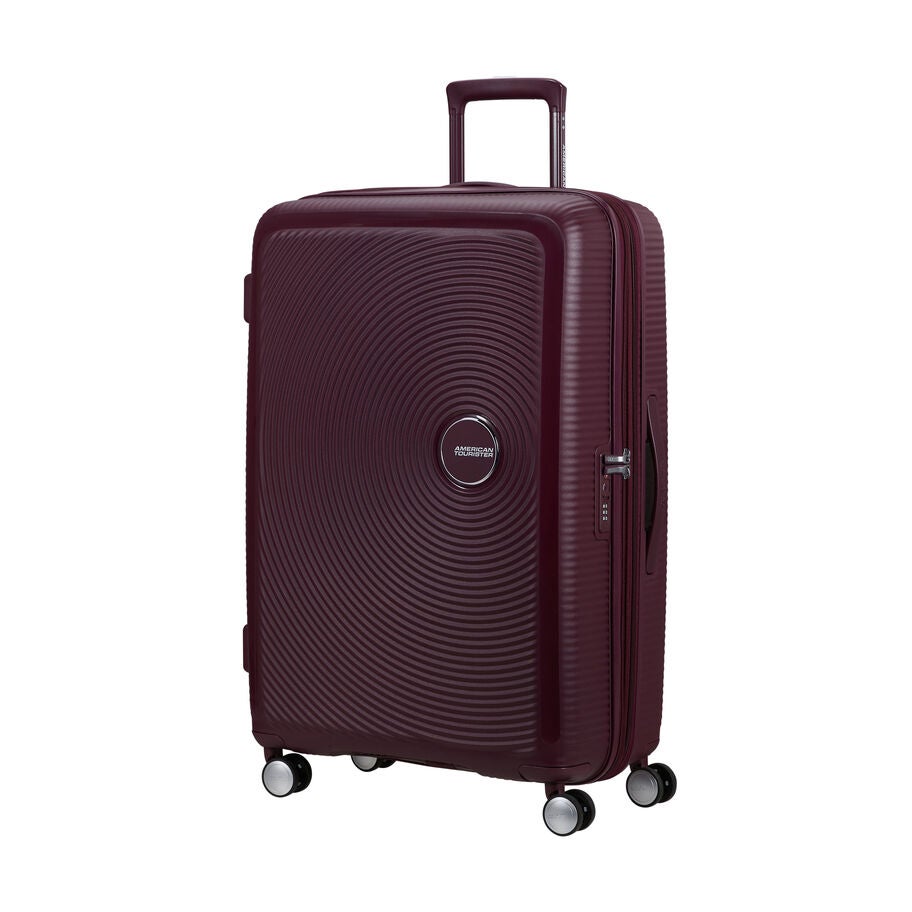 American Tourister Curio Spinner Grand in the color Cerise Sauvage. image number 0
